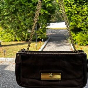 Chic Black Leather Shoulder Bag with Gold Accents